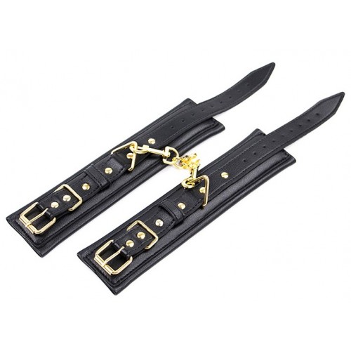 Черные поножи с золотистой цепочкой